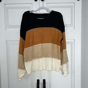 Tan and black sweater.